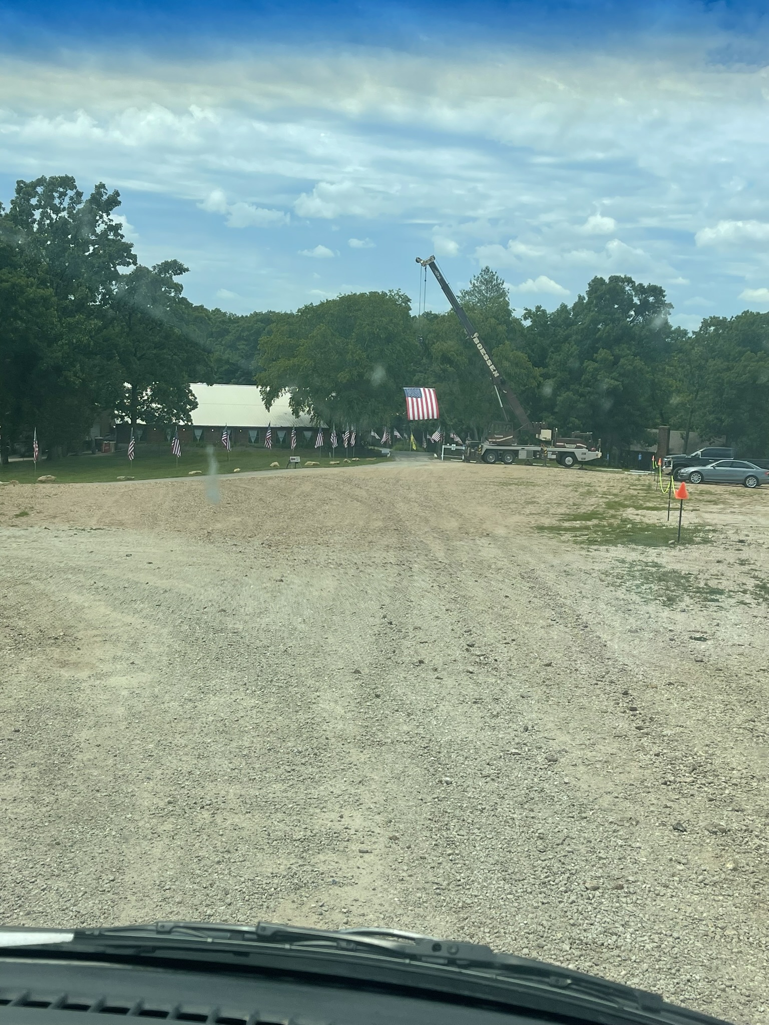 firetruck displaying American flag for military funeral